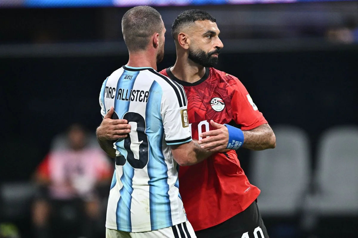 Mohamed Salah and Alexis Mac Allister after the FIFA World Cup 2026 Round of 16 match between Argentina and Egypt.