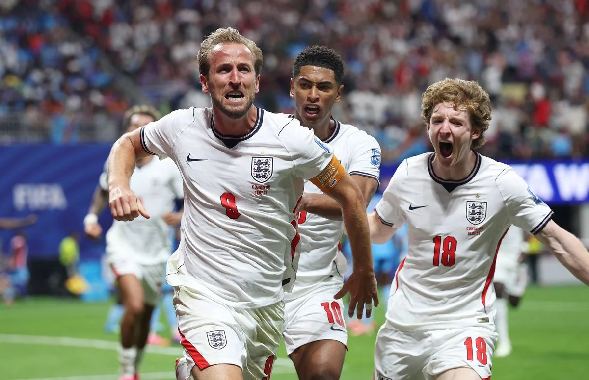 Harry Kane #9 of England celebrates with teammates Jude Bellingham #10 and Anthony Gordon #18 after scoring his team's first goal during the FIFA World Cup 2026 Round Of 32 match between England and Congo DR