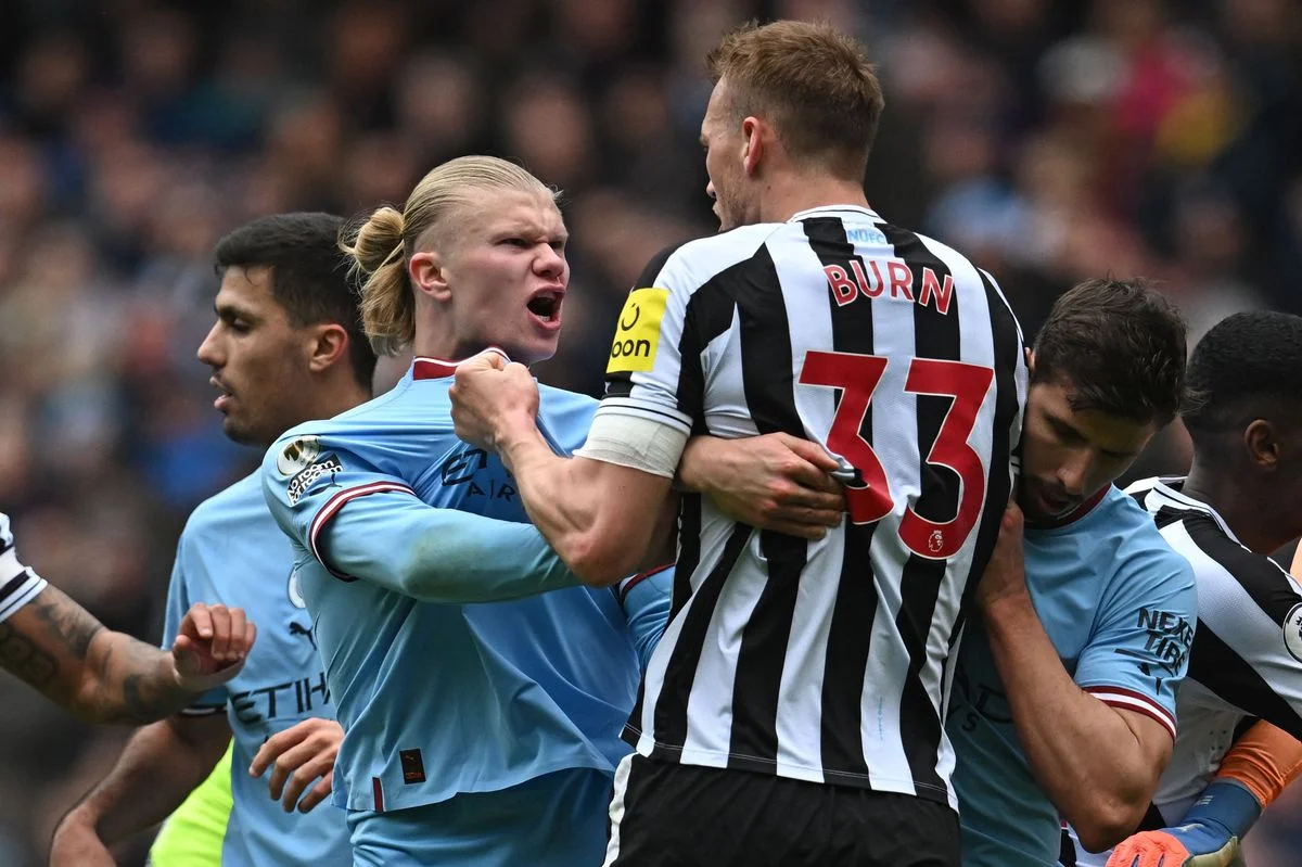 Erling Haaland clashes with defender Dan Burn 
