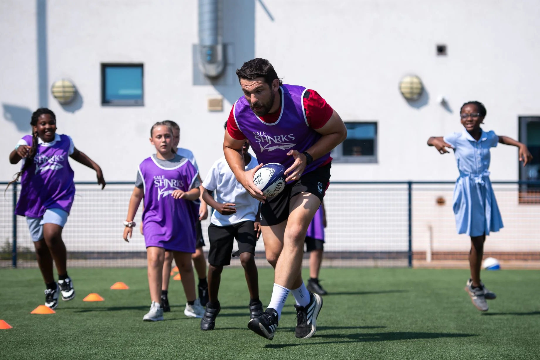 Charlie Ewels joins local schoolchildren for a T1 rugby session at the People's Hub