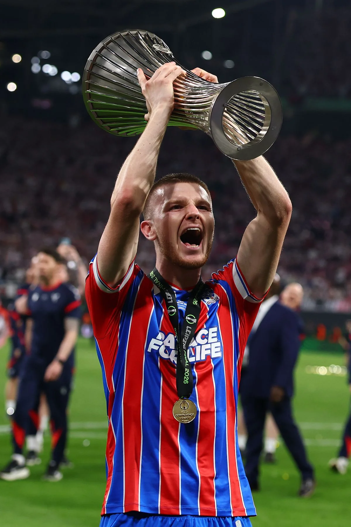 Adam Wharton of Crystal Palace celebrates with the trophy at the end of the UEFA Conference League Final 2026 match between Crystal Palace FC and Rayo Vallecano de Madrid at Football Arena Leipzig
