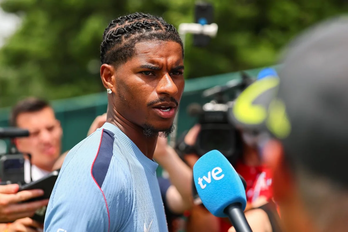 Marcus Rashford speaks to the media during a press conference.