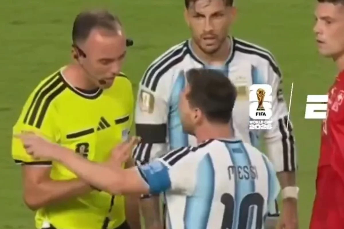 Lionel Messi clashes with a referee